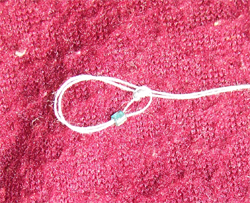 Knoten und die erste Perle