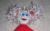 der Puppe ein Gesicht geben